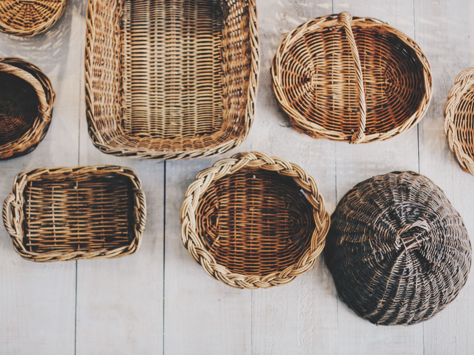 DIY gift basket ideas - woven baskets of various sizes and shapes all lined up